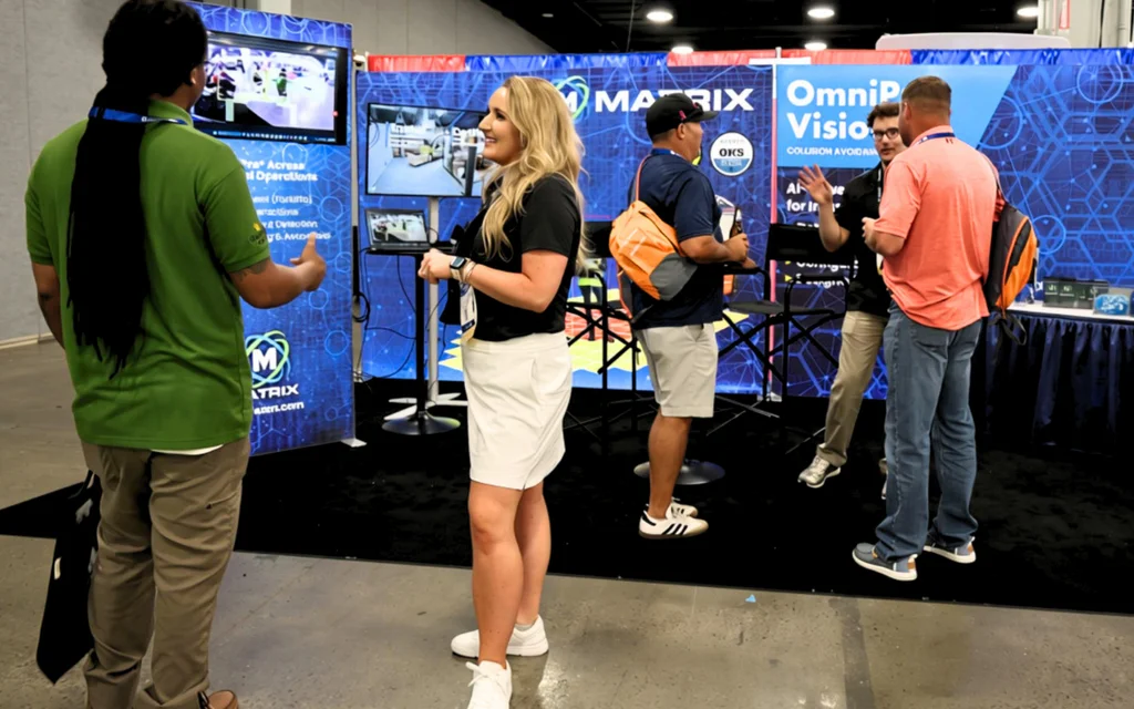 Attendees discussing industrial safety technology at the Matrix booth during VPPPA Safety+ 2026