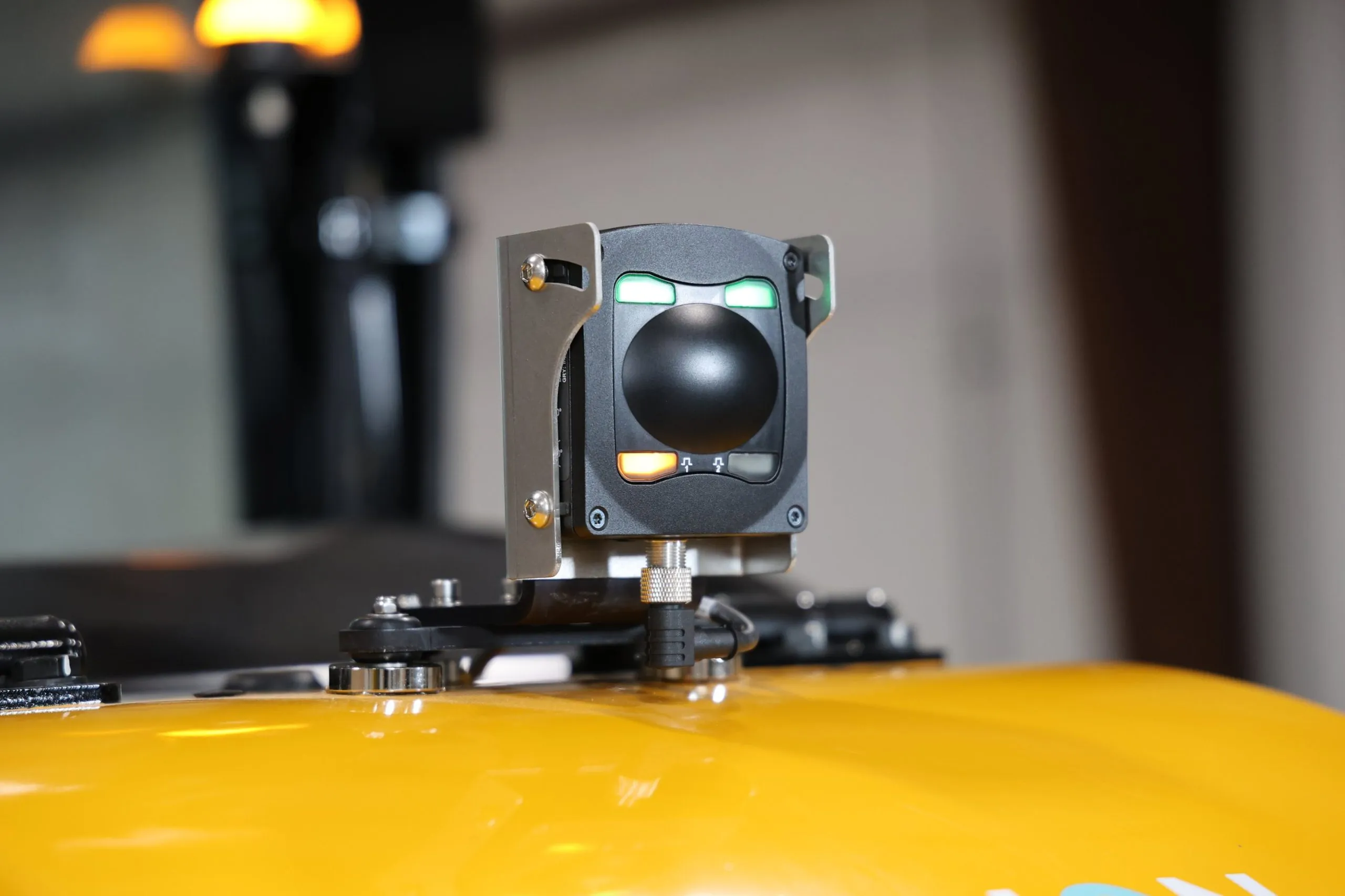 OmniPro Radar Sensor mounted on a magnetic bracket on the rear of a yellow forklift